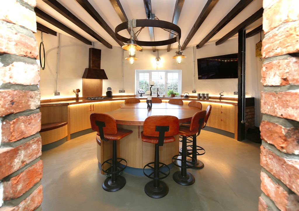 Curved bespoke kitchen cabinetry in Lincoln windmill property